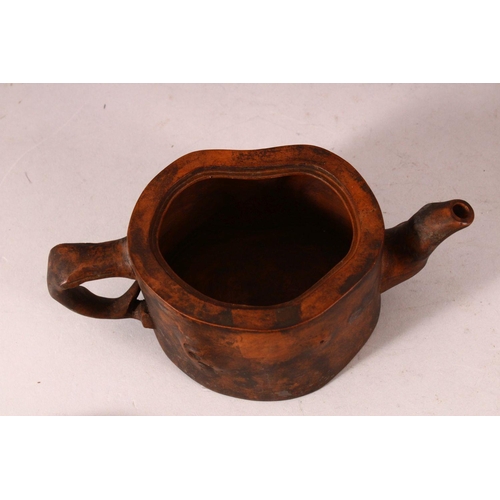 171 - A CHINESE YIXING TEAPOT, of naturalistic form, 20cm wide.