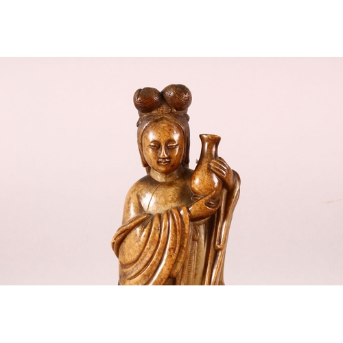 181 - A GOOD 18TH / 19TH CENTURY CHINESE SOAPSTONE GROUP, the central female figure holding an urn, a chil... 