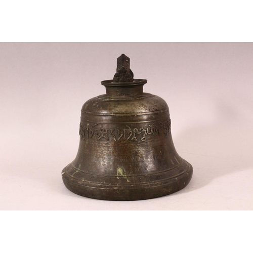 182 - A TIBETAN CAST BRONZE TEMPLE BELL, with a band of calligraphy to the exterior and a possible signatu... 