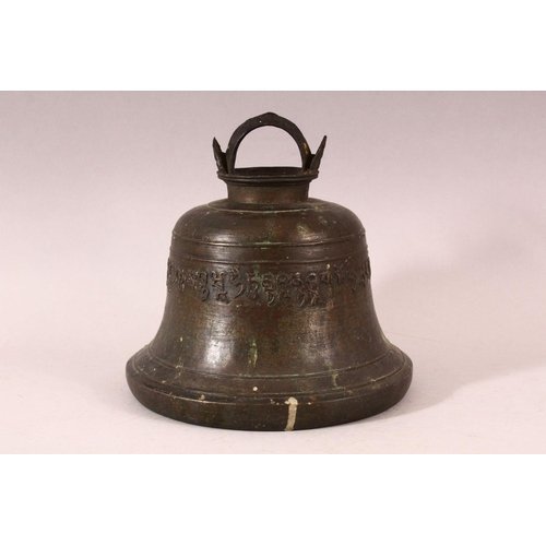 182 - A TIBETAN CAST BRONZE TEMPLE BELL, with a band of calligraphy to the exterior and a possible signatu... 