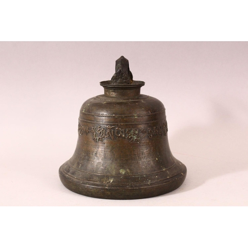 182 - A TIBETAN CAST BRONZE TEMPLE BELL, with a band of calligraphy to the exterior and a possible signatu... 