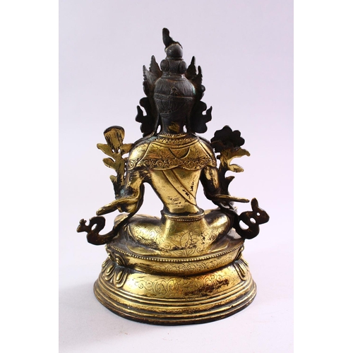 188 - A TIBETAN GILT BRONZE FIGURE OF A SEATED FEMALE DIETY, on lotus pad, 24cm high.