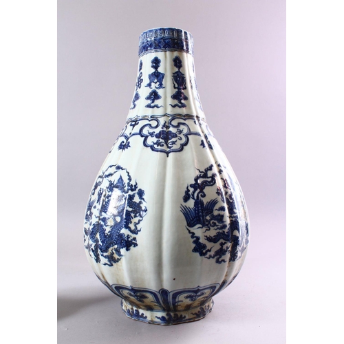 193 - A LARGE KANGXI STYLE RIBBED PEAR-SHAPED BOTTLE VASE AND COVER, painted with panels of dragons, phoen... 