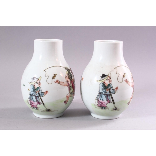 194 - A PAIR OF CHINESE REPUBLICAN STYLE PORCELAIN VASES, each painted with scenes of playful treatment, 1... 