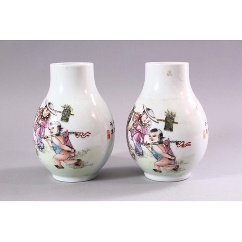 194 - A PAIR OF CHINESE REPUBLICAN STYLE PORCELAIN VASES, each painted with scenes of playful treatment, 1... 