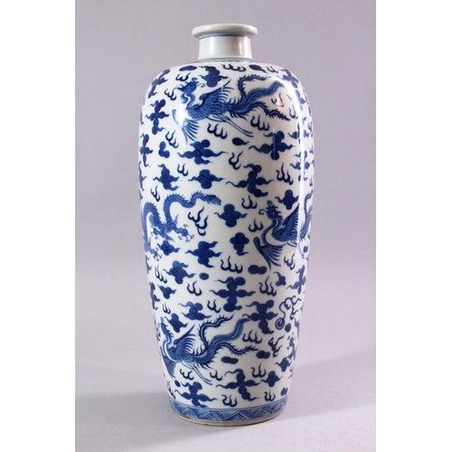 195 - A GOOD CHINESE BLUE AND WHITE VASE, painted all over with dragons and phoenix amongst clouds, collec... 