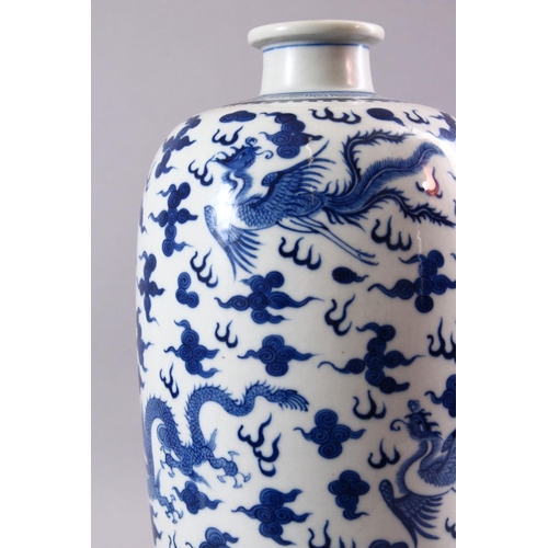 195 - A GOOD CHINESE BLUE AND WHITE VASE, painted all over with dragons and phoenix amongst clouds, collec... 