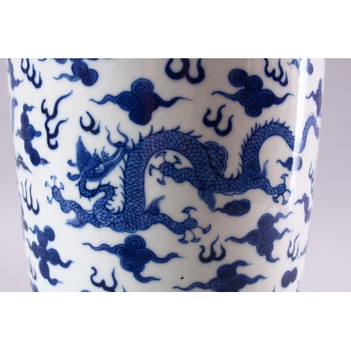 195 - A GOOD CHINESE BLUE AND WHITE VASE, painted all over with dragons and phoenix amongst clouds, collec... 