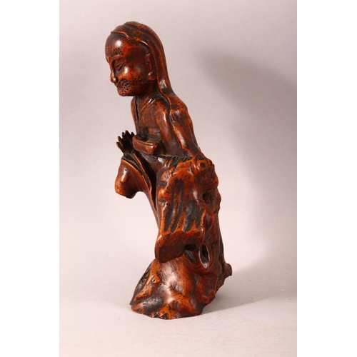 197 - A CHINESE CARVED ROOTWOOD FIGURE OF A SAGE, 29cm high.