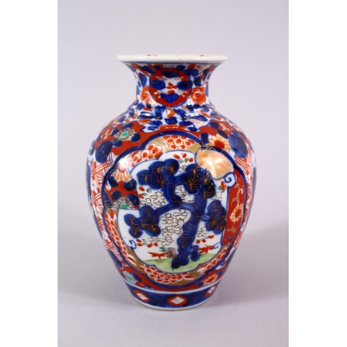 2 - A JAPANESE MEIJI PERIOD IMARI PORCELAIN VASE, decorated with panel views of pine trees, phoenix and ... 