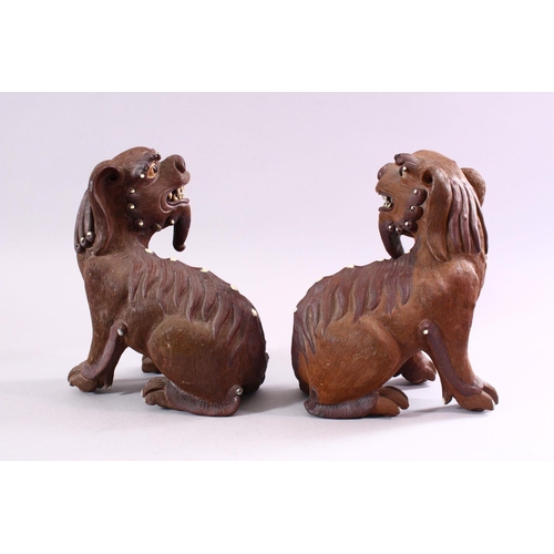 201 - A GOOD PAIR OF CHINESE 19TH CENTURY TERRACOTTA FORMED LION DOG FIGURES, the mirrored pair with glaze... 