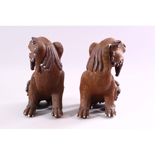 201 - A GOOD PAIR OF CHINESE 19TH CENTURY TERRACOTTA FORMED LION DOG FIGURES, the mirrored pair with glaze... 