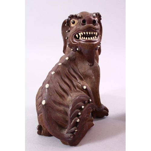 201 - A GOOD PAIR OF CHINESE 19TH CENTURY TERRACOTTA FORMED LION DOG FIGURES, the mirrored pair with glaze... 