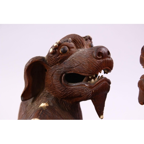 202 - A GOOD PAIR OF CHINESE 19TH CENTURY TERRACOTTA FORMED LION DOG FIGURES, Modeled as male and female, ... 