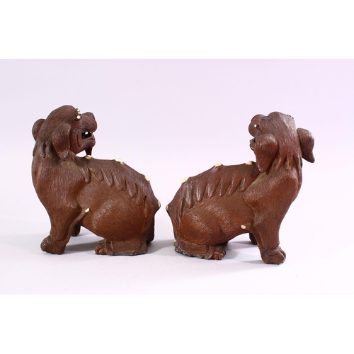 202 - A GOOD PAIR OF CHINESE 19TH CENTURY TERRACOTTA FORMED LION DOG FIGURES, Modeled as male and female, ... 