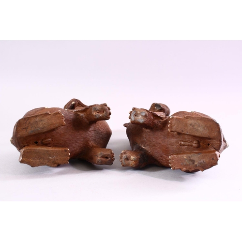 202 - A GOOD PAIR OF CHINESE 19TH CENTURY TERRACOTTA FORMED LION DOG FIGURES, Modeled as male and female, ... 