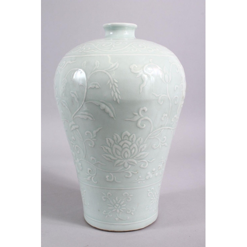 203 - A CHINESE CELADON CARVED PORCELAIN MEIPING LOTUS VASE - FOR THE ISLAMIC MARKET, carved with scenes o... 