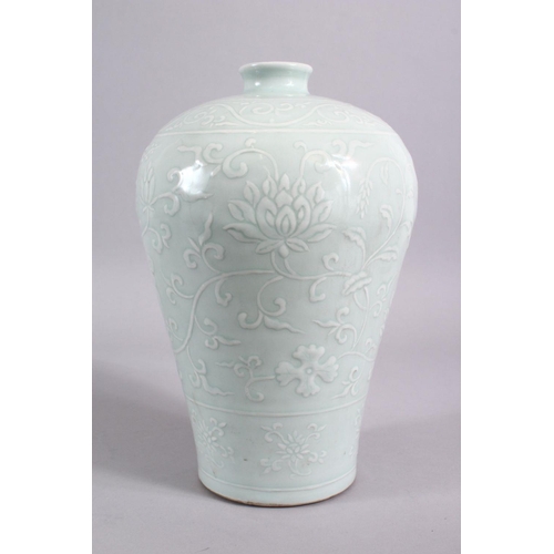 203 - A CHINESE CELADON CARVED PORCELAIN MEIPING LOTUS VASE - FOR THE ISLAMIC MARKET, carved with scenes o... 