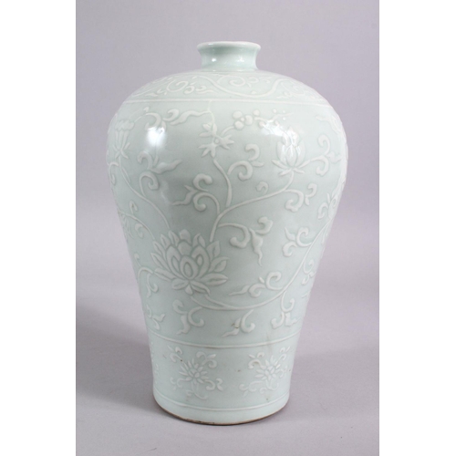 203 - A CHINESE CELADON CARVED PORCELAIN MEIPING LOTUS VASE - FOR THE ISLAMIC MARKET, carved with scenes o... 