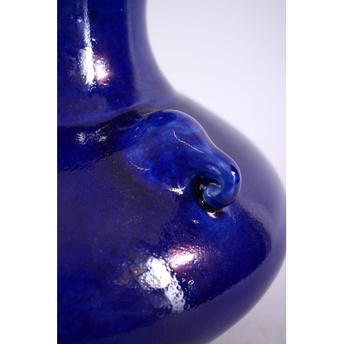 205 - A CHINESE BLUE GROUND TRIPLE HANDLE PORCELAIN VASE, With a deep royal blue ground, with triple mould... 