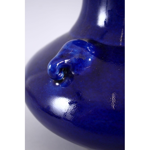 205 - A CHINESE BLUE GROUND TRIPLE HANDLE PORCELAIN VASE, With a deep royal blue ground, with triple mould... 