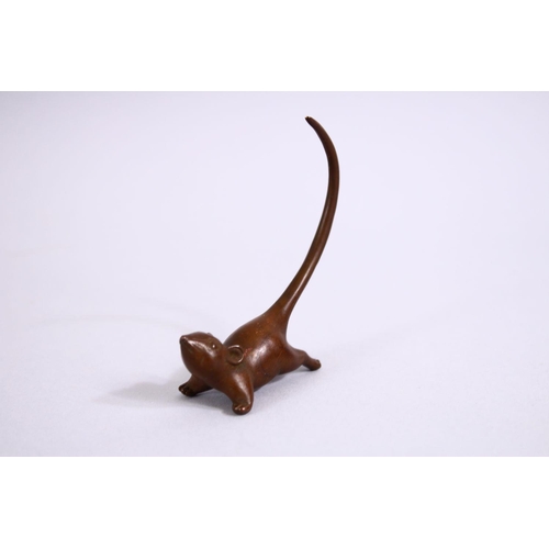 21 - A JAPANESE BRONZE FIGURE OF A RAT , looking aloft with his tail raised, stamped seal to base, 8cm.