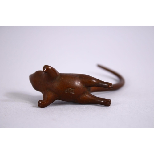 21 - A JAPANESE BRONZE FIGURE OF A RAT , looking aloft with his tail raised, stamped seal to base, 8cm.