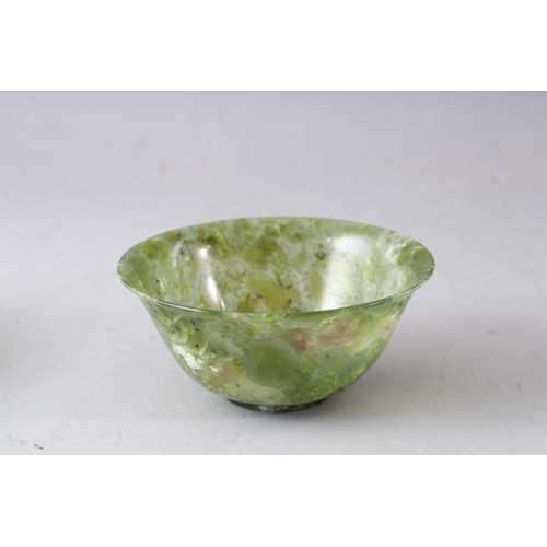 212 - A SMALL PEKING GLASS BOWL and a similar bowenite bowl, both 10cm diameter.