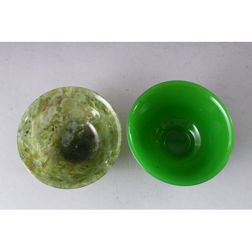 212 - A SMALL PEKING GLASS BOWL and a similar bowenite bowl, both 10cm diameter.