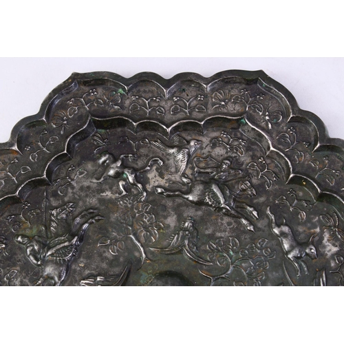 221 - A LARGE 18TH CENTURY CHINESE CAST BRONZE MIRROR, the decoration depicting a hunting scene, 24cm diam... 