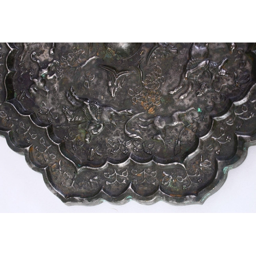 221 - A LARGE 18TH CENTURY CHINESE CAST BRONZE MIRROR, the decoration depicting a hunting scene, 24cm diam... 