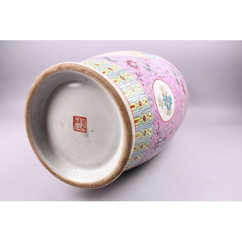 223 - A LARGE CHINESE REPUBLIC STYLE FAMILLE ROSE PORCELAIN VASE, with a pink ground  and panles depicting... 