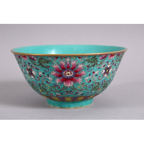 23 - A CHINESE FAMMILE ROSE TURQUOISE GROUND LOTUS PORCELAIN BOWL, decorated with formal scrolling lotus ... 