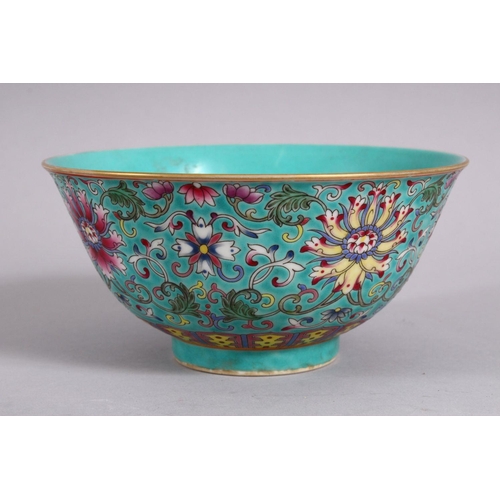 23 - A CHINESE FAMMILE ROSE TURQUOISE GROUND LOTUS PORCELAIN BOWL, decorated with formal scrolling lotus ... 