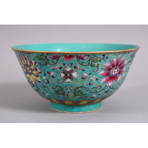 23 - A CHINESE FAMMILE ROSE TURQUOISE GROUND LOTUS PORCELAIN BOWL, decorated with formal scrolling lotus ... 