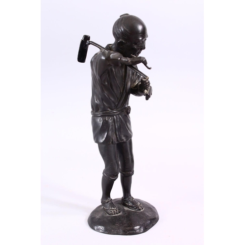 232 - A JAPANESE MEIJI PERIOD BRONZE OKIMONO - SMOKING MAN, the figure stood upon stylized base, holding h... 