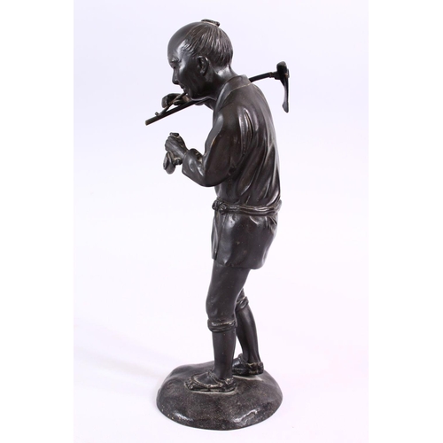 232 - A JAPANESE MEIJI PERIOD BRONZE OKIMONO - SMOKING MAN, the figure stood upon stylized base, holding h... 