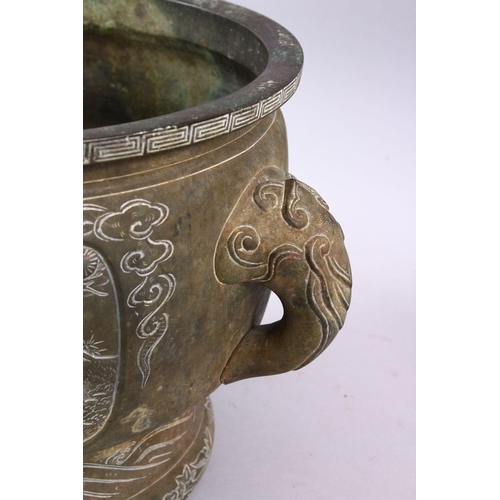 233 - A 19TH CENTURY CHINESE BRONZE IMMORTAL TWIN HANDLED CENSER, with carved panel decoration depicting i... 