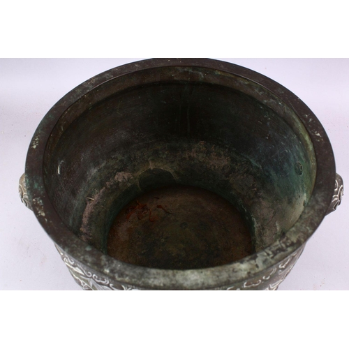 233 - A 19TH CENTURY CHINESE BRONZE IMMORTAL TWIN HANDLED CENSER, with carved panel decoration depicting i... 