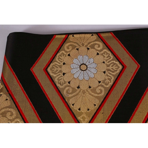 240 - A FINE JAPANESE SILK EMBROIDERED FUKURO OBI TIE - upon a black ground with silver and gold coloured ... 