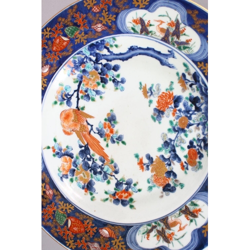 248 - A FINE EARLY 19TH CENTURY JAPANESE IMARI PORCELAIN CHARGER, central decoration of a bird upon a tree... 