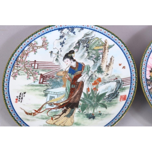 25 - A SET OF SIX CHINESE FAMILLE ROSE PORCELAIN PLATES, each with a different view of a female figure in... 