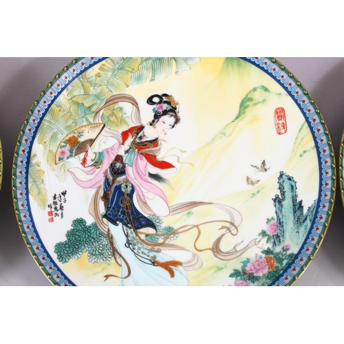 25 - A SET OF SIX CHINESE FAMILLE ROSE PORCELAIN PLATES, each with a different view of a female figure in... 