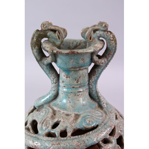 251 - A CHINESE TANG STYLE CELEDON GLAZED DOUBLE WALLED BOTTLE VASE, with dragon handles, 27cm.