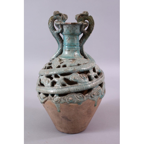 251 - A CHINESE TANG STYLE CELEDON GLAZED DOUBLE WALLED BOTTLE VASE, with dragon handles, 27cm.