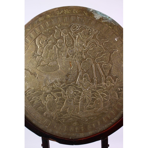 252 - A LARGE CHINESE CIRCULAR CAST BRONZE 'MIRROR' on a hardwood stand (stand AF), disc 46cm diameter.