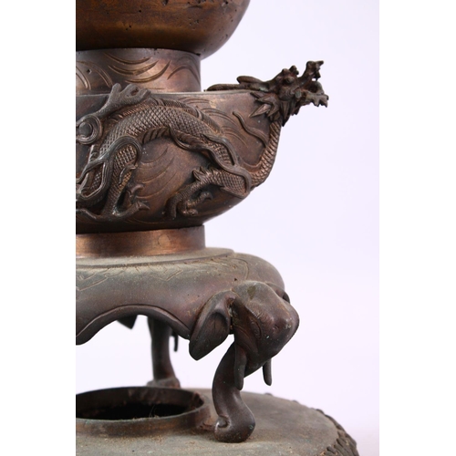 253 - A JAPANESE THREE SECTION CAST BRONZE CENSER, with elephant heads supports, dragons, birds amongst tr... 