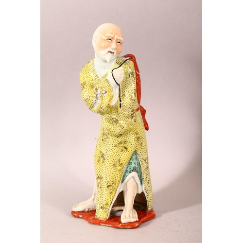 266 - A CHINESE FAMILLE JAUNE PORCELAIN FIGURE OF A FISHERMAN, together with a similar famille verte figur... 