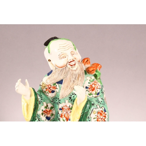 266 - A CHINESE FAMILLE JAUNE PORCELAIN FIGURE OF A FISHERMAN, together with a similar famille verte figur... 