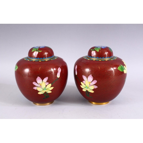 272 - A PAIR OF CHINESE CLOISONNE GINGER JARS AND COVERS, decorated with a bird amongst flowers, 16cm high... 